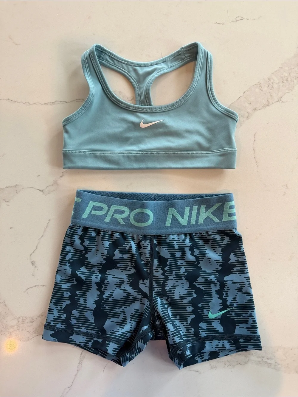 Girls Nike Light/Powder Blue Sports Bra and Patterned Navy Pro Shorts